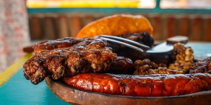 A delicious plate of traditional Argentine asado with grilled meats and sausage in Argentina.